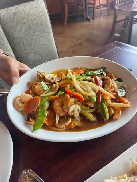 serving plate of prawns with cashew nuts in a thai restaurant